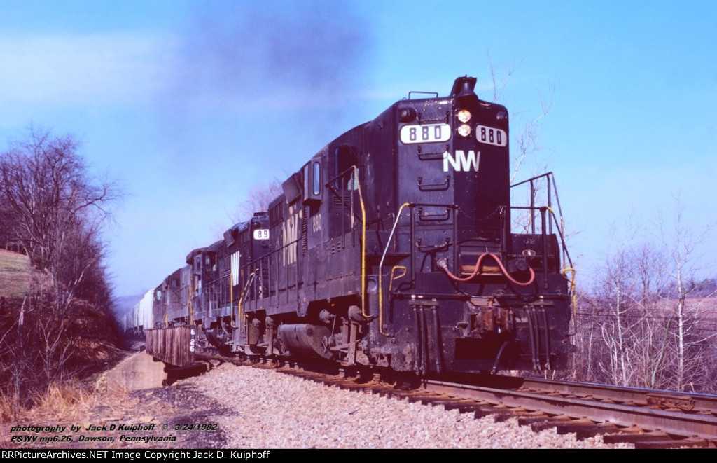 N&W, Norfolk Western  880-899-8074-6155, GR14, on the ex-P&WV at mp6.26, bridge over Eannotti Road, Chaintown, Pennsylvania, March 24, 1982. 